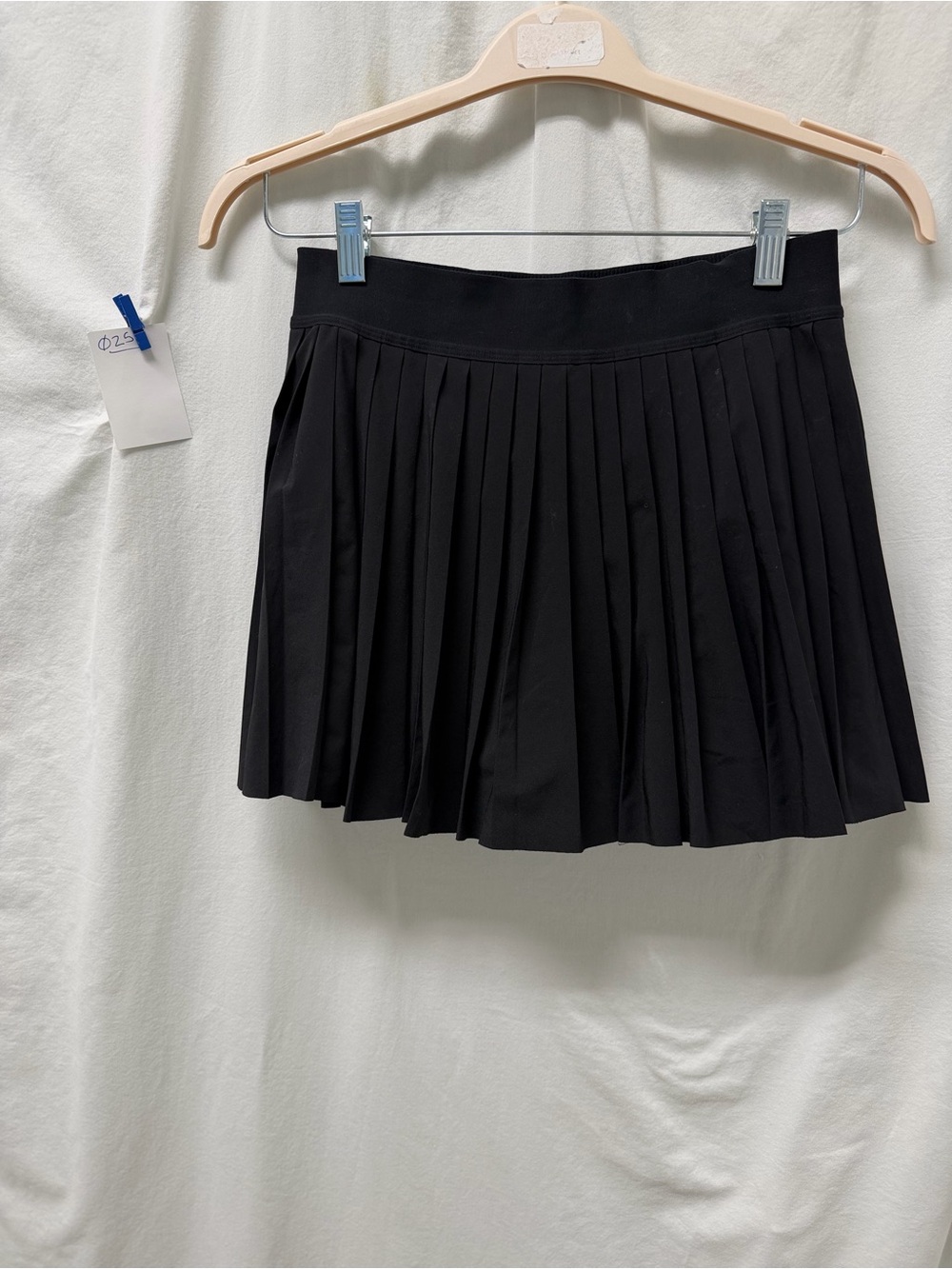 Athleta black match point pleated laser cut skort